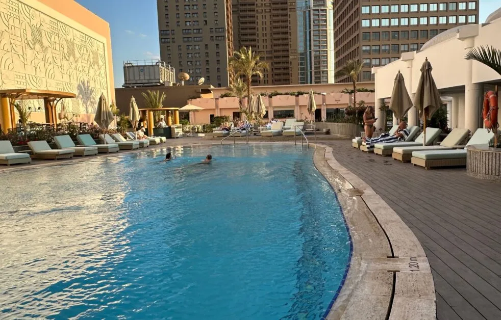 Guests enjoy the Swimming Pool at the Sofitel Nile Hotel Cairo.