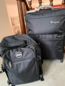 Black bag with zipper that can be taken on as hand luggage to an aircraft. Photo is part of a featured 10kg allowance and no fees blog post.