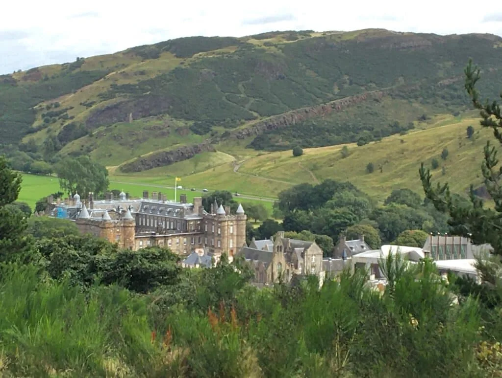 Hollyrood Palace is nestled amongst green spaces with trees and hills surrounding it although it is in the city centre of Edinburgh.