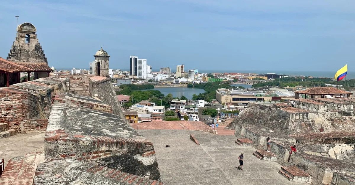 View of Cartagena from Old Fortress showing stone walls and large terrace area.