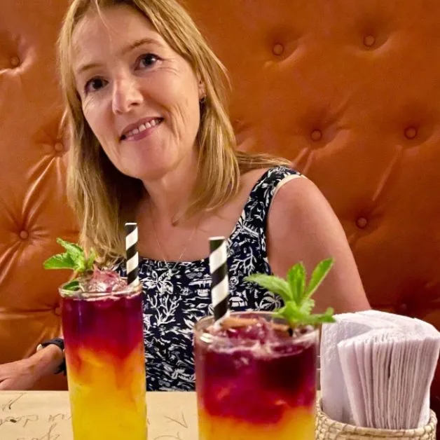 Woman enjoying a cocktail.