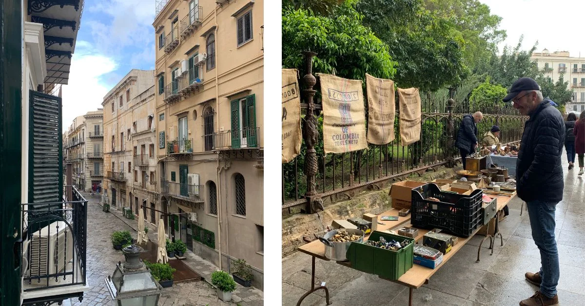 Side street of houses with balconies and flea market with tables laid out and a man looking at objects for sale