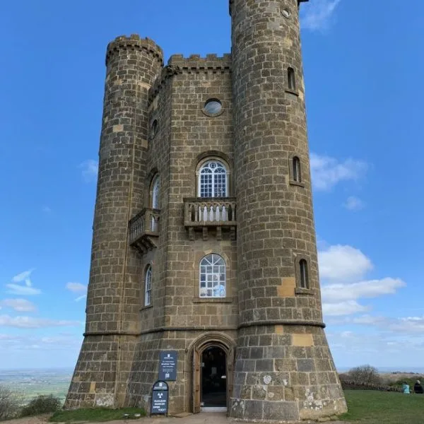 A large stone tower with turrets in Cotswolds England.