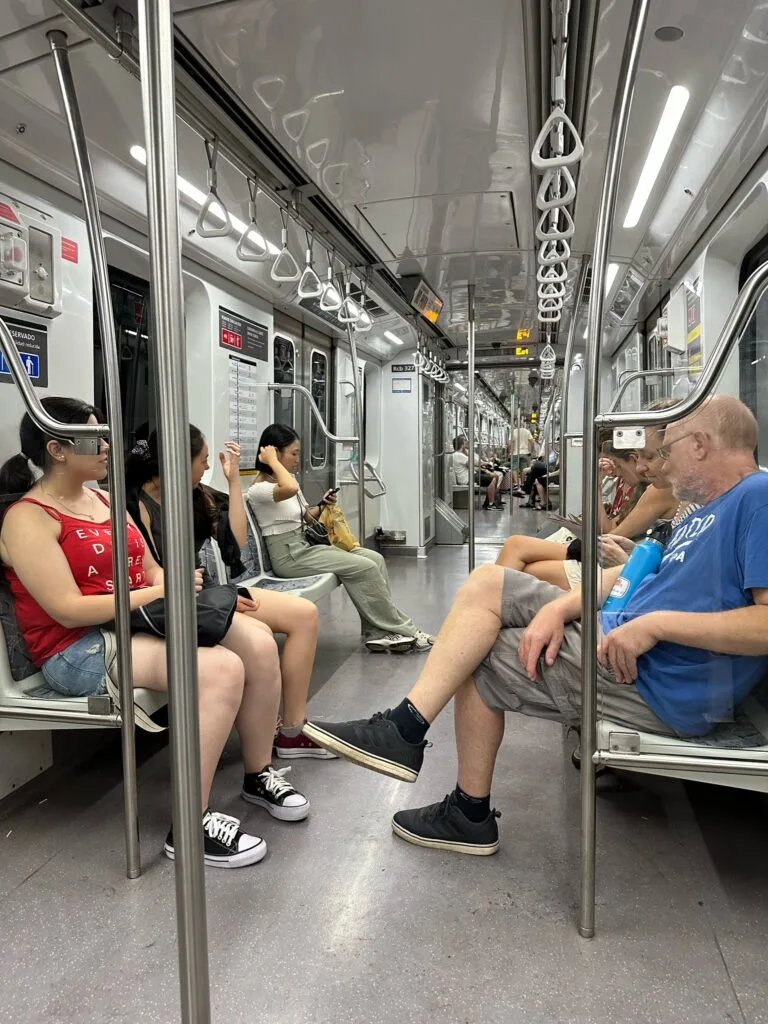 Subte in Buenos Aires is the underground system. People are sitting in a carriage, as they travel from one part of the city to another very quickly.