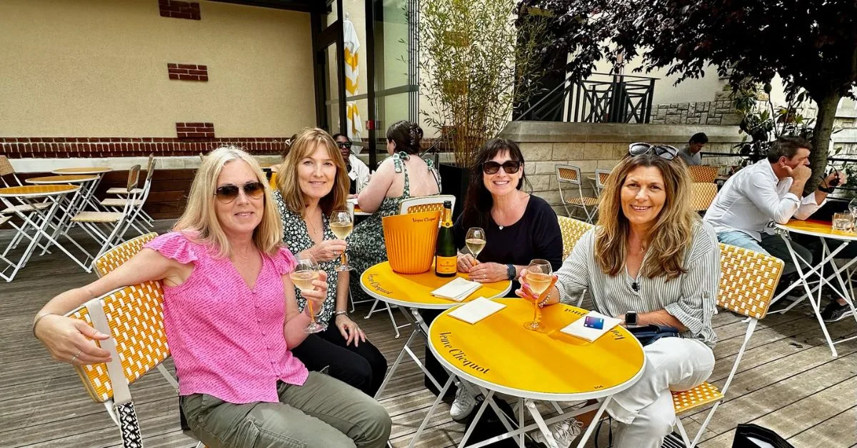 Group of women sipping champagne in Reims.