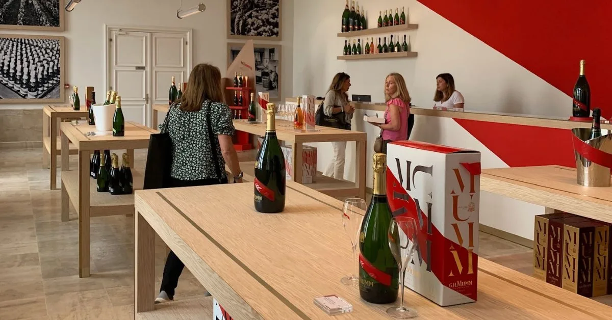 Bottles on display and customer’s browsing at GH Mumm Champagne house