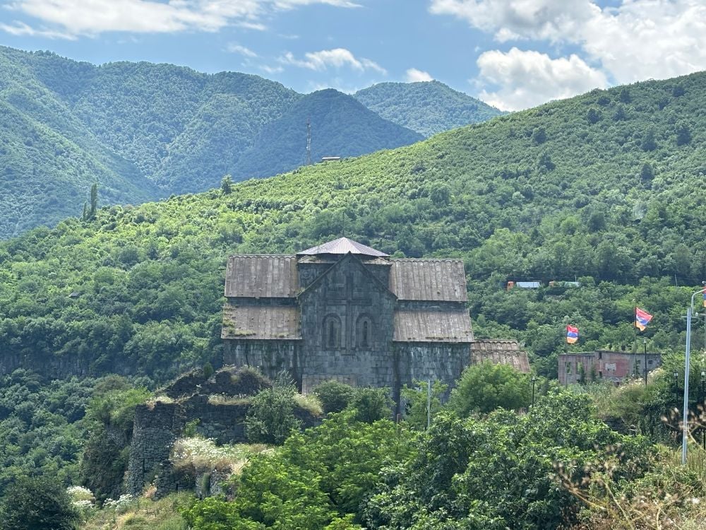 Akhtala Monastery perched dramatically amongst trees and mountains