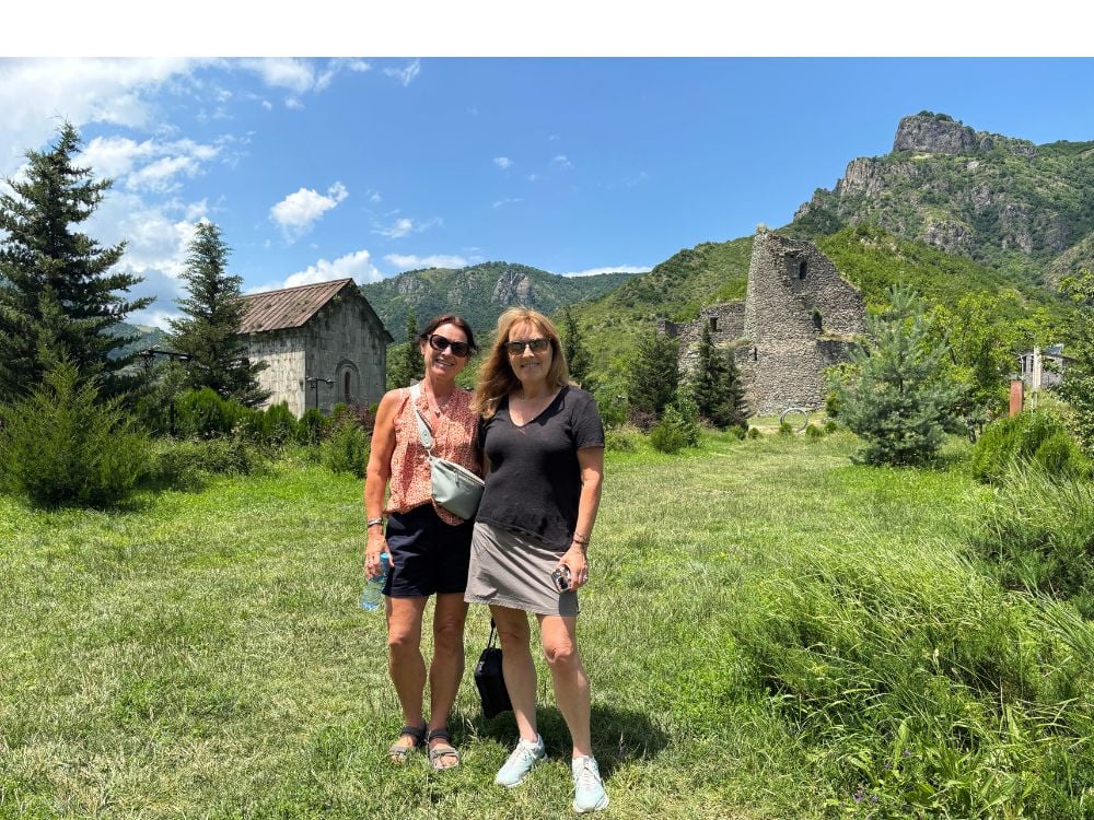 Tourists visiting the Akhtala ruins and exploring the site