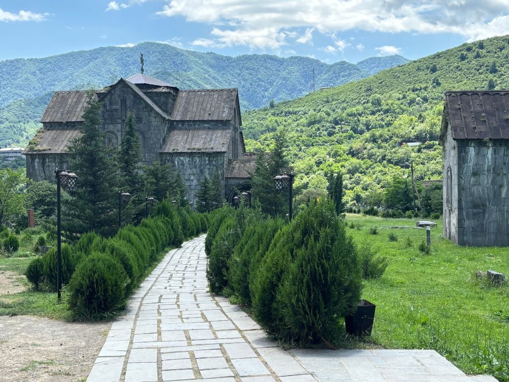 Akhtala Monastery stone church perched dramatically above the gorge in Northern Armenia