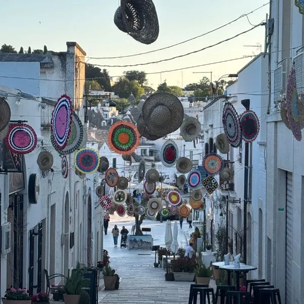 Street in Alberobello decorated with traditional baskets and local crafts