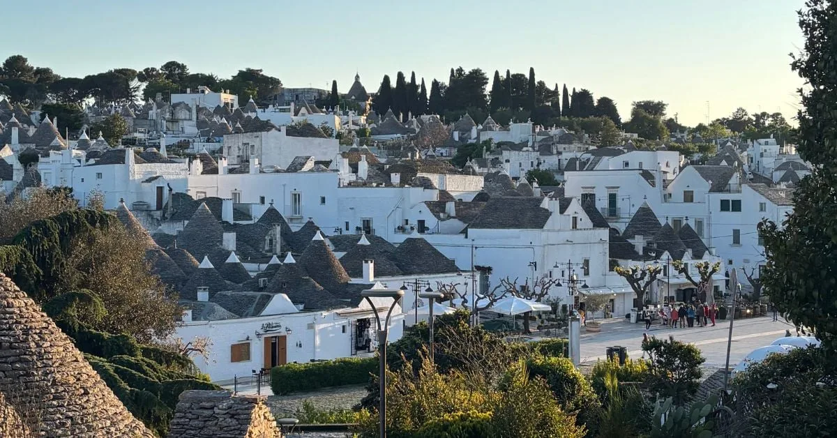 Iconic trulli houses cascading down the hillside in Alberobello, Puglia