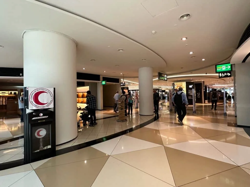 Baku International Airport interior showing a shopping area.