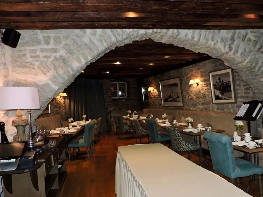 A stone arch entry way into a cellar style restaurant in Tallinn.