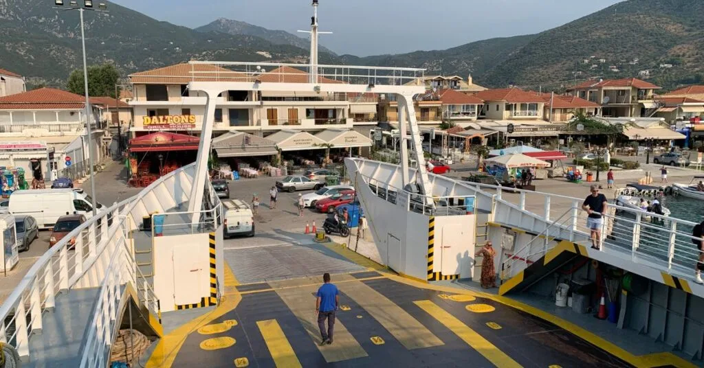 Tourist ferry boarding cars and passengers in Nydri harbour