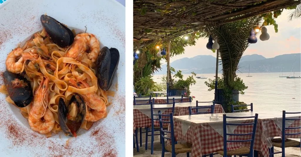 Plate of scallops and prawns and dining tables with red checked cloths and blue chairs set by the beach