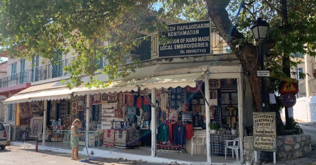 Large Handicraft shop with canopy and goods for sale hung up outside
