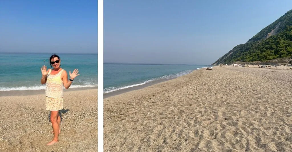 Quiet beach and woman standing alone on the shingle sand next to the sea