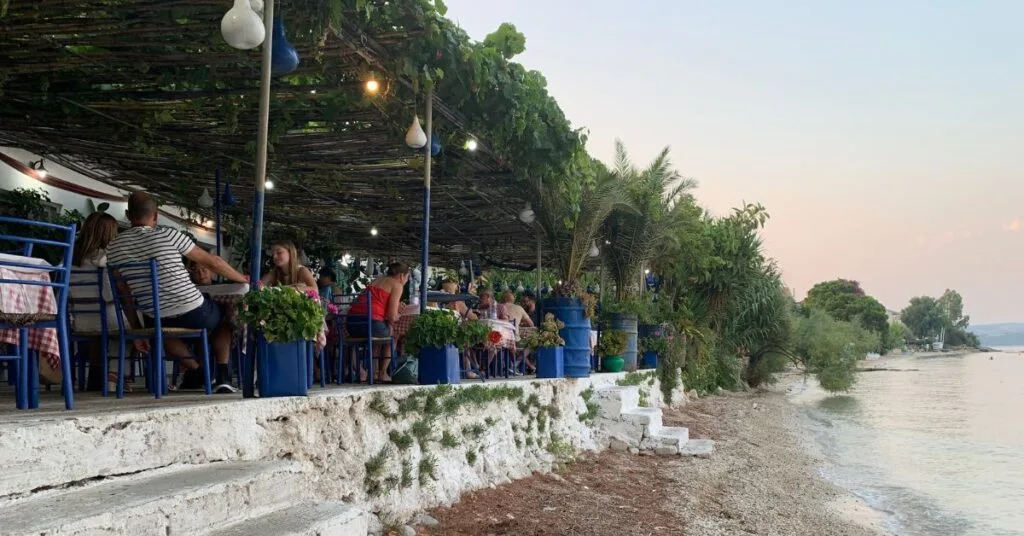Casual Restaurant by the sea with tables looking out the beach