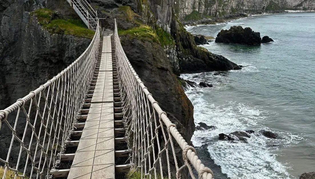 A narrow rope bridge in Carrick-A-Rede linking the mainland and a small rock island.
