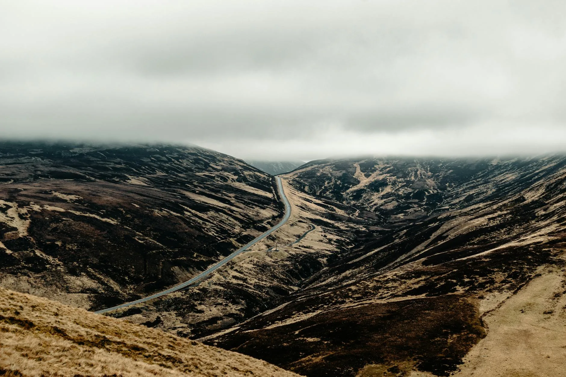 Winding road through Scottish Highlands