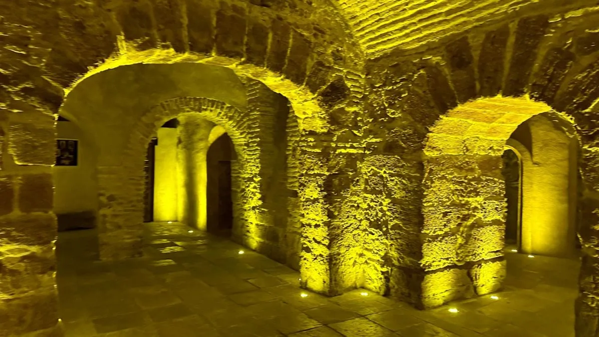 Cave interior with atmospheric yellow lighting in Cádiz