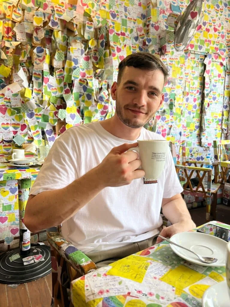 A Tourist drinking Vietnamese Egg Coffee in a restaurant in Hanoi