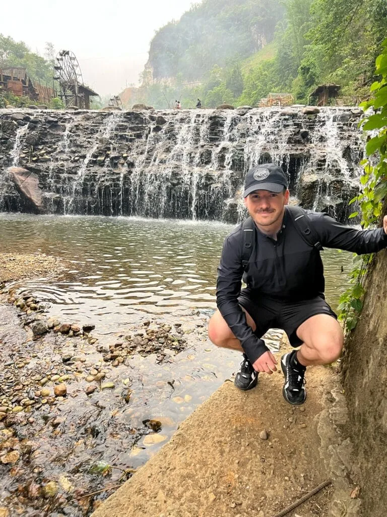 Traveler next to a waterfall in Vietnam