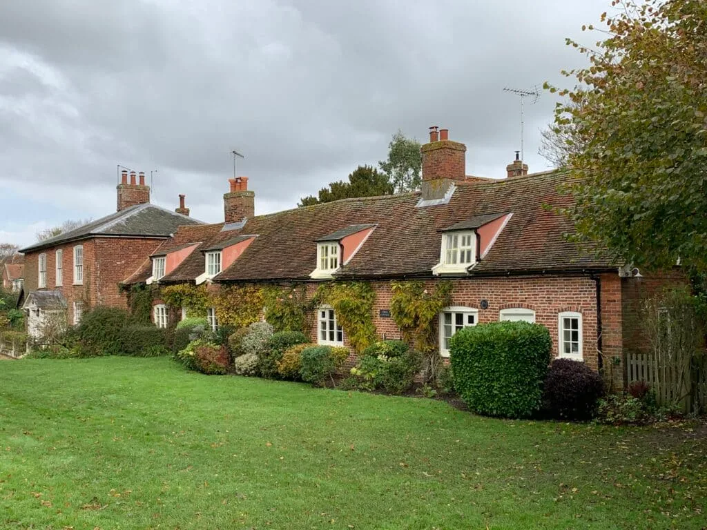 Traditional red brick and red tile roofs of English village homes.