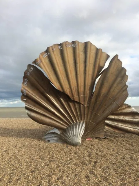 A giant scallop sits on a beach in Suffolk, England.