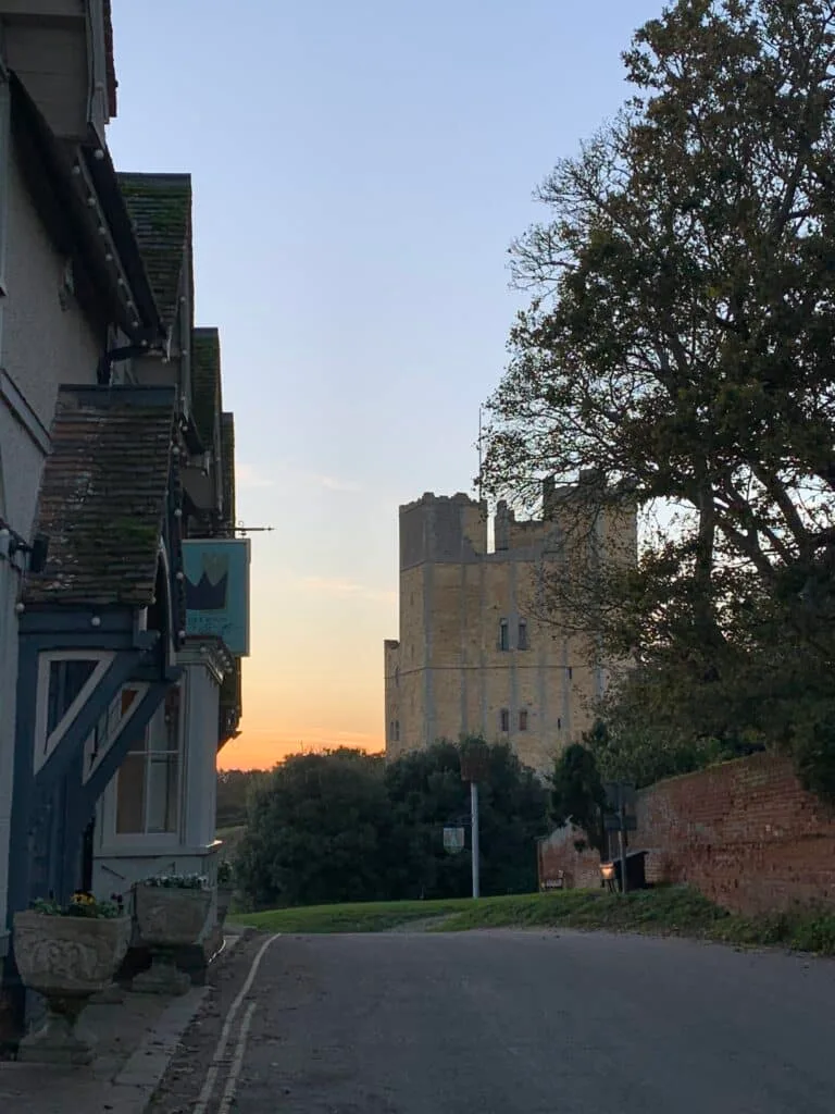 A road and at the end is at turret of Orford Castle