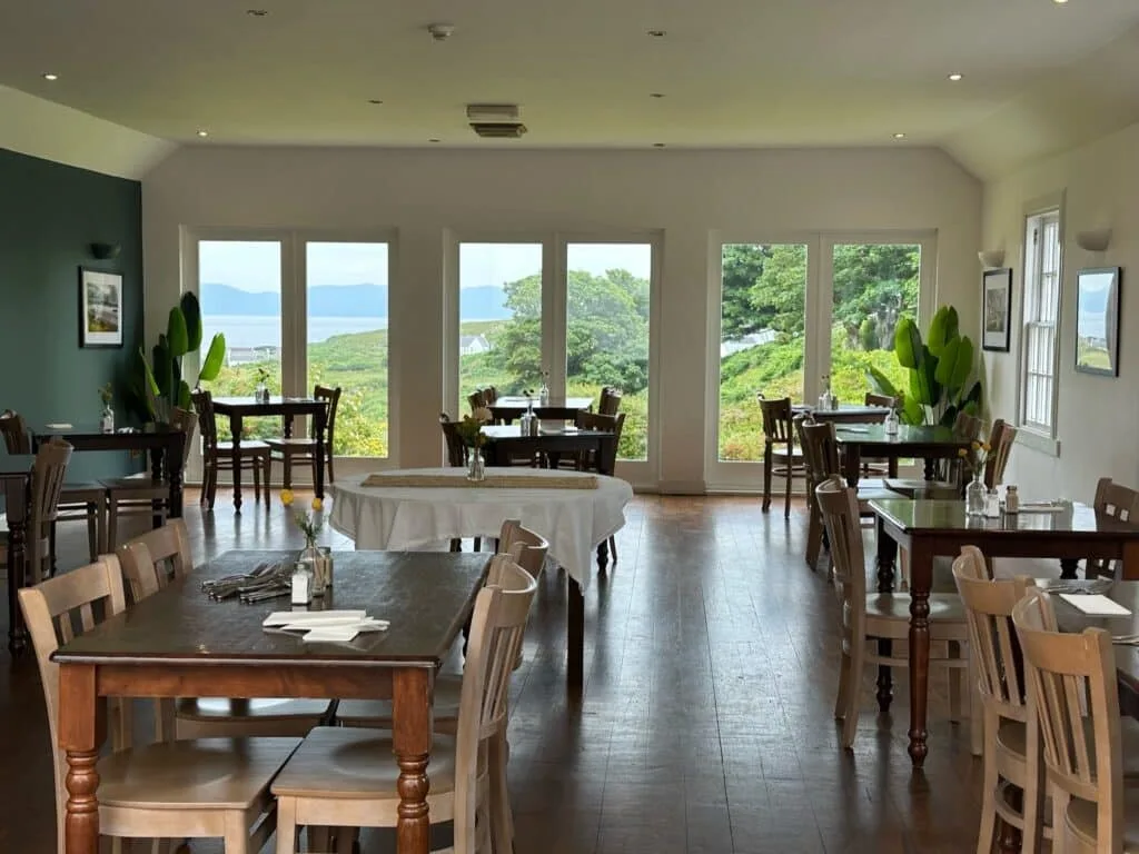 Colonsay hotel has a spacious restaurant. The views from the large glass windows are down to the harbour.