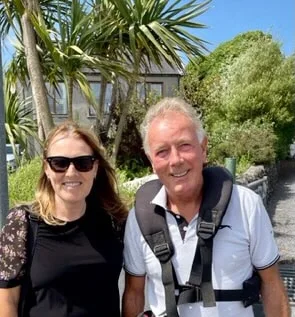 A woman tourist meets the world famous Jim McEwan Master Distiller on Islay.