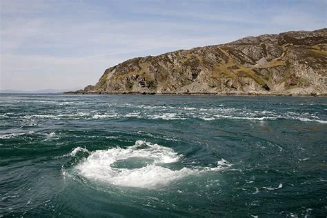 Corryvrechan whirlpool off Islay and Jura in Atlantic Ocean with cliff in background