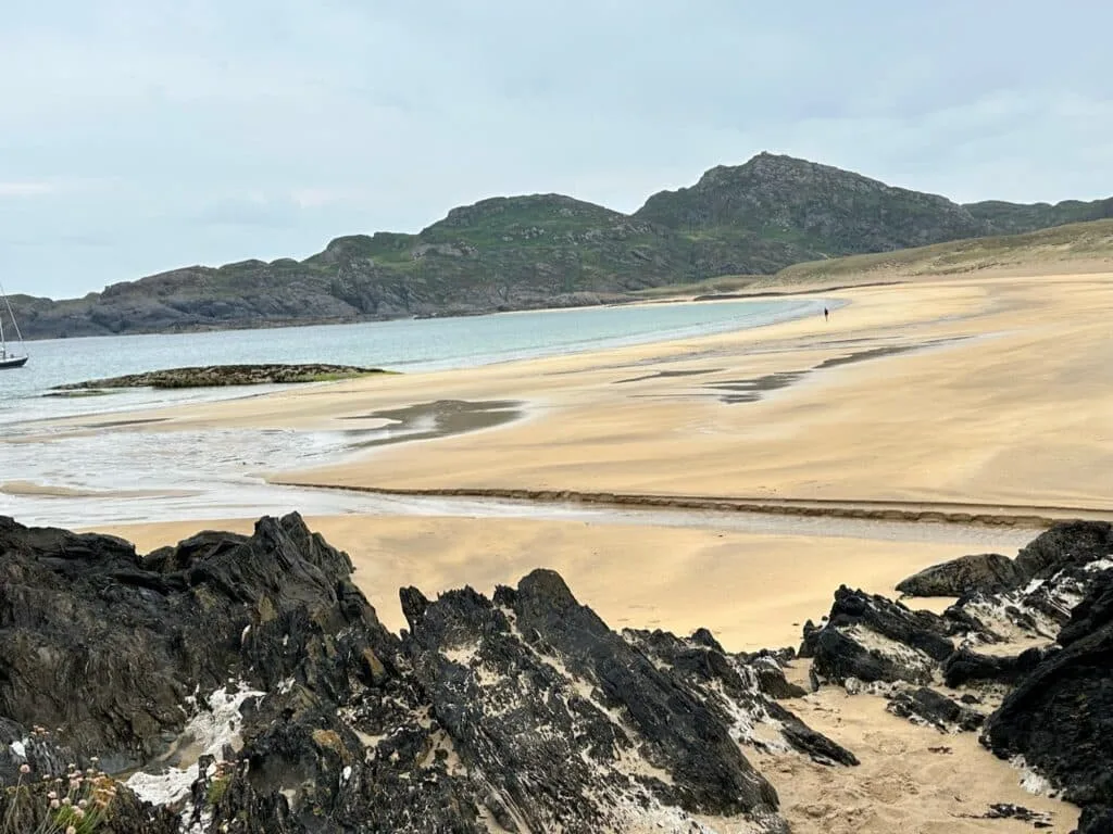 A deserted sandy beach with rocky Craigs on Colonsay Island, Scotland.
