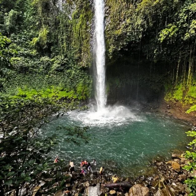 A waterfall shows water flowing into a pool near Arenal Costa Rica.