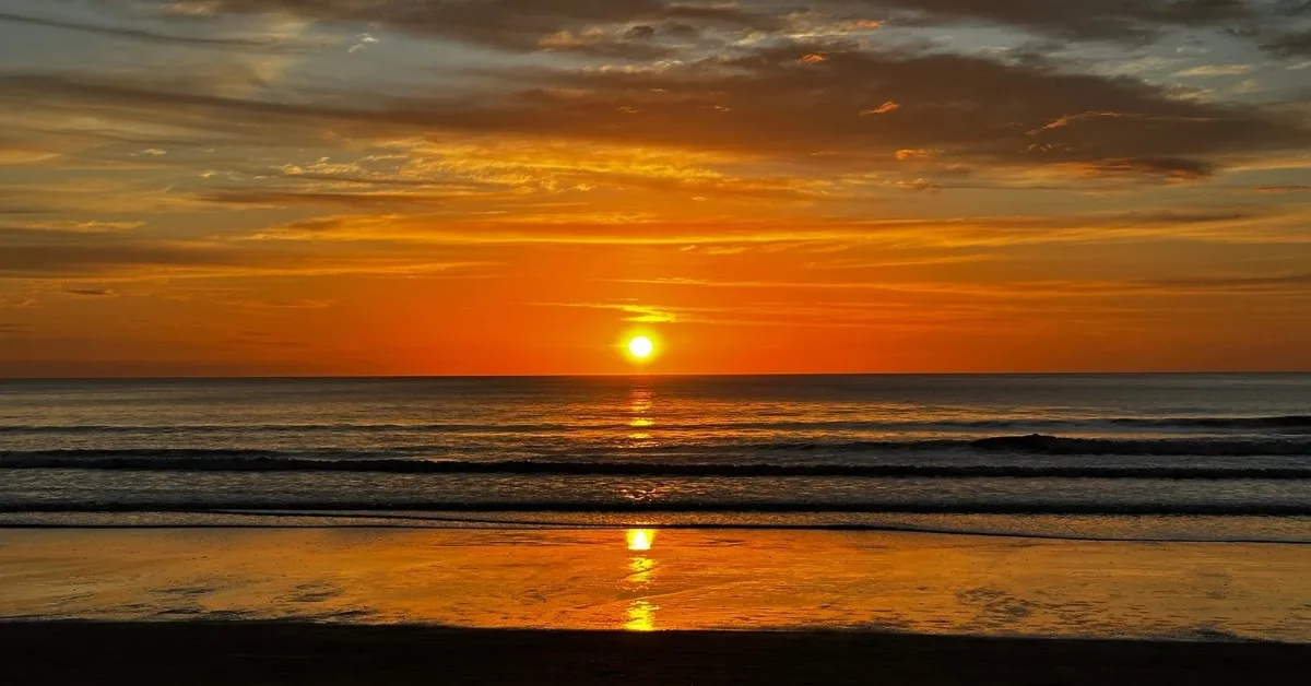 An orange sky over the ocean at Playa Grande Costa Rica.