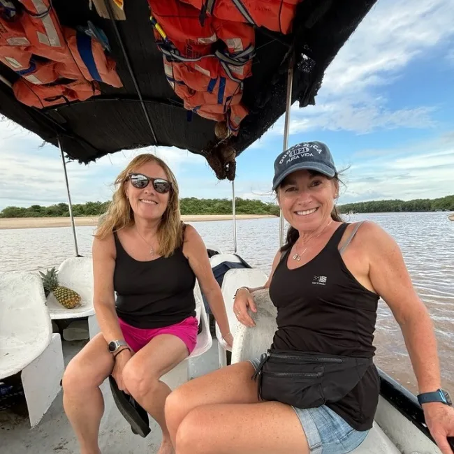 Boat taxi taking two women from Playa Grande to Tamarindo in Costa Rica.