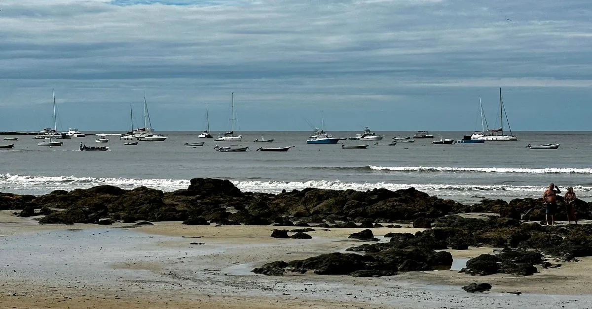 Boats anchored off the beach of Tamarindo Costa Rica.
