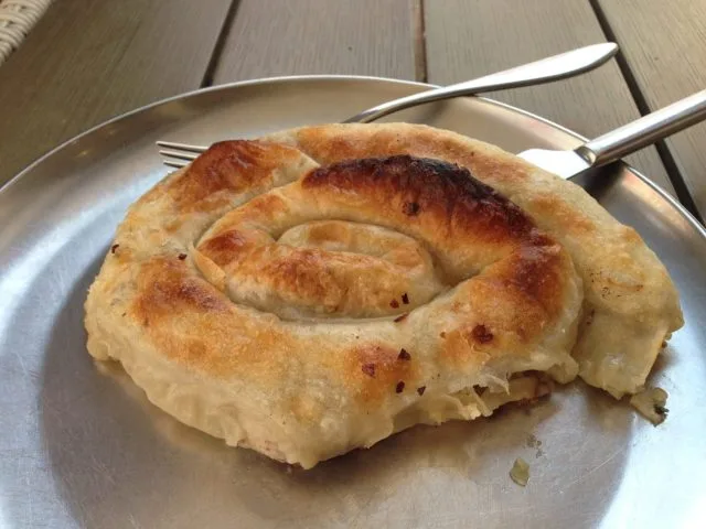 A freshly baked savory pastry called Borek with a cheese filling.