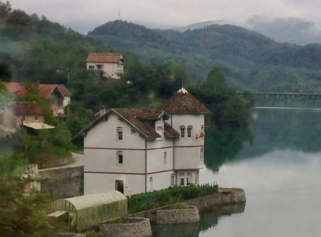 Homes dot the banks of the Neretva River in Bosnia.