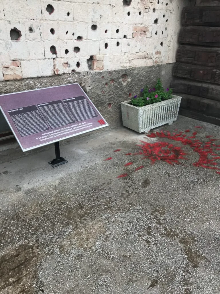Sarajevo Roses are painted on pavements as a tribute to where people died during the war.