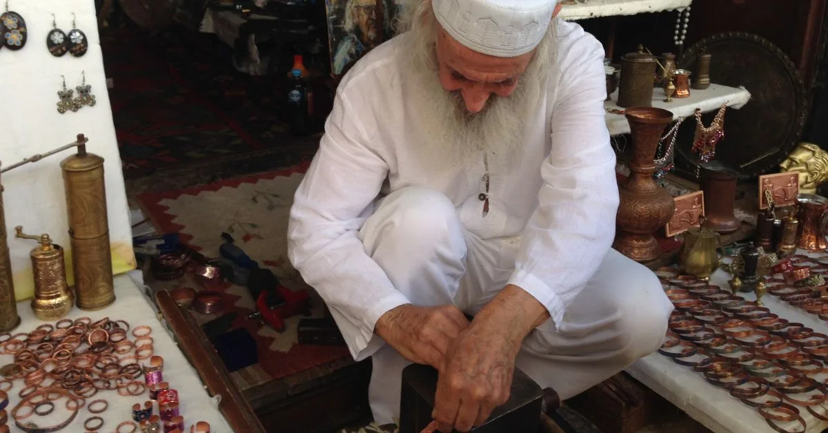 A traditional coppersmith in his workshop in Old Bazaar Sarajevo