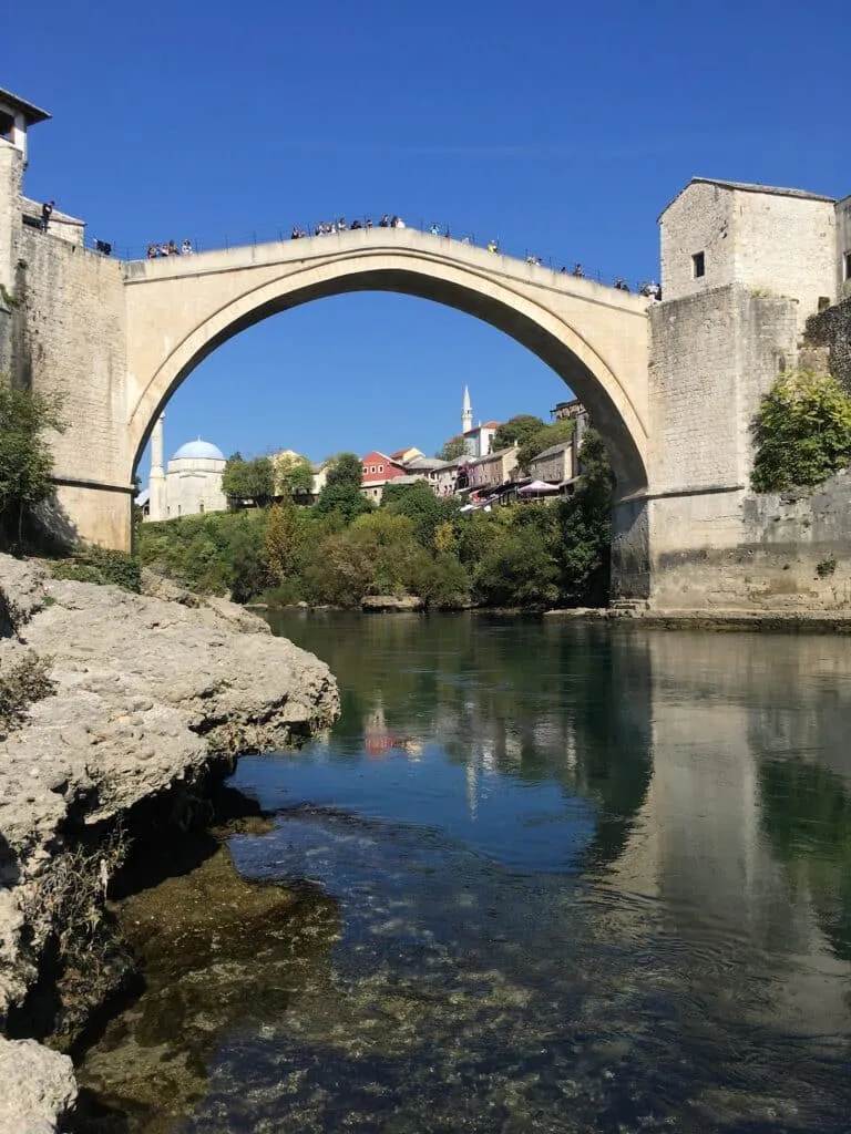 People standing on top of Stari Most bridge in Mostar Herzegovina.