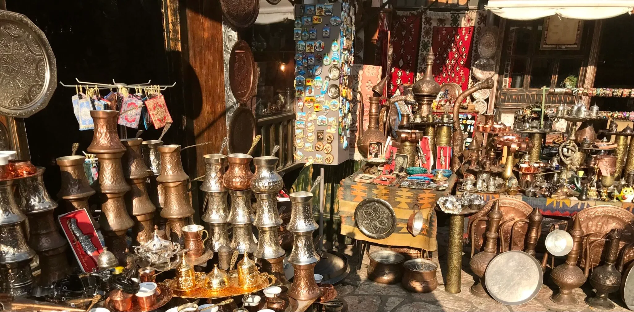 Copper and silver coffee pots and cups on display in Kujundžiluk Bazaar in Mostar.