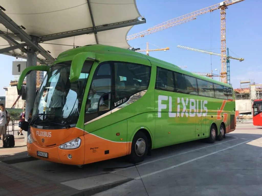 A tourist bus - Flixbus - painted green and orange.