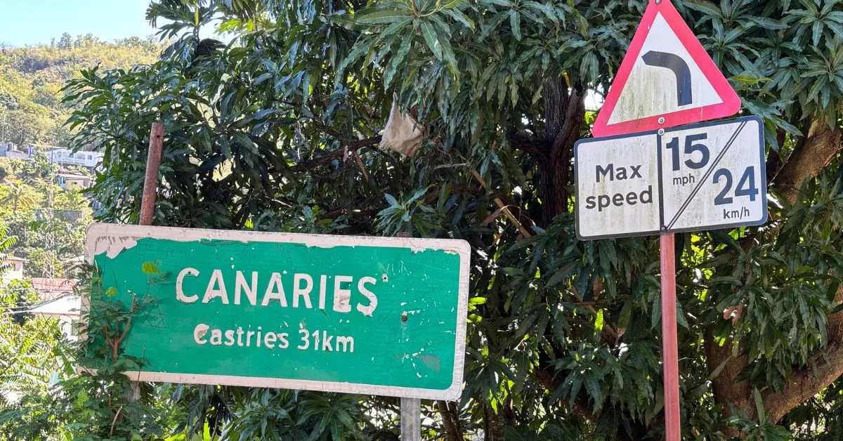 Road signs in St Lucia showing the town name of Canaries and speed limit sign