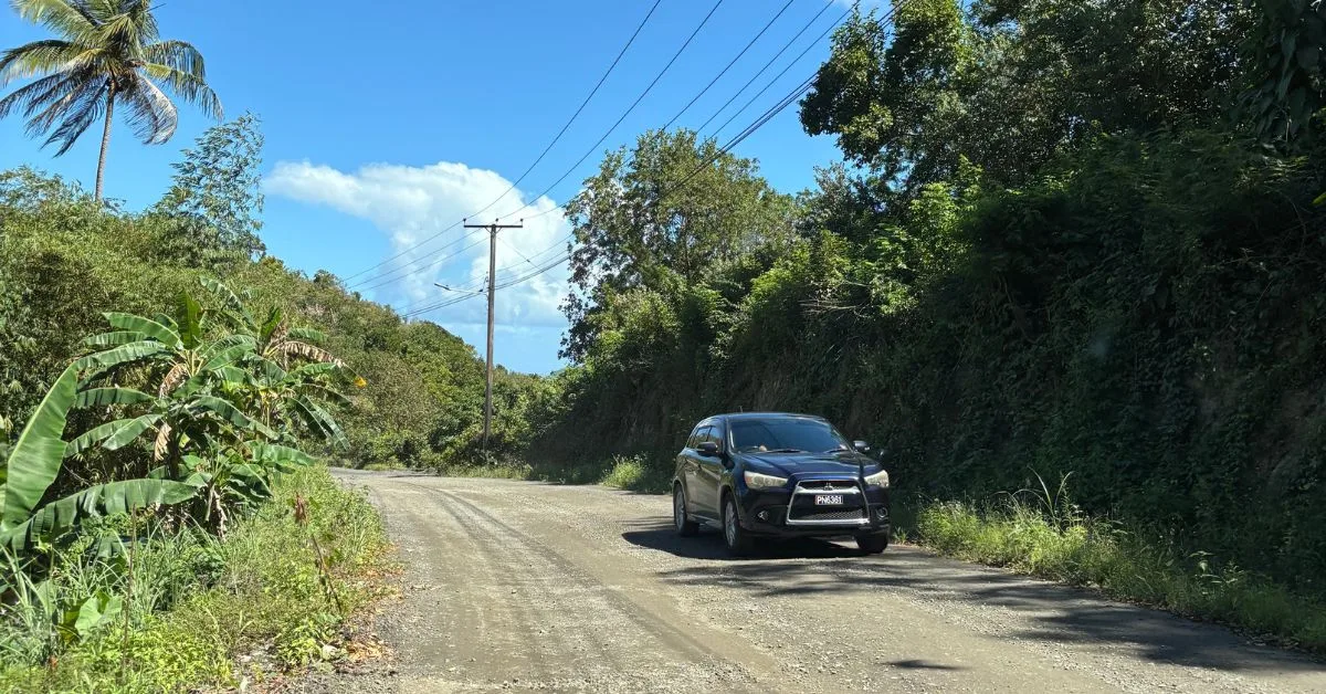 Unpaved road in St Lucia showing room to pass with another car coming in the opposite direction.