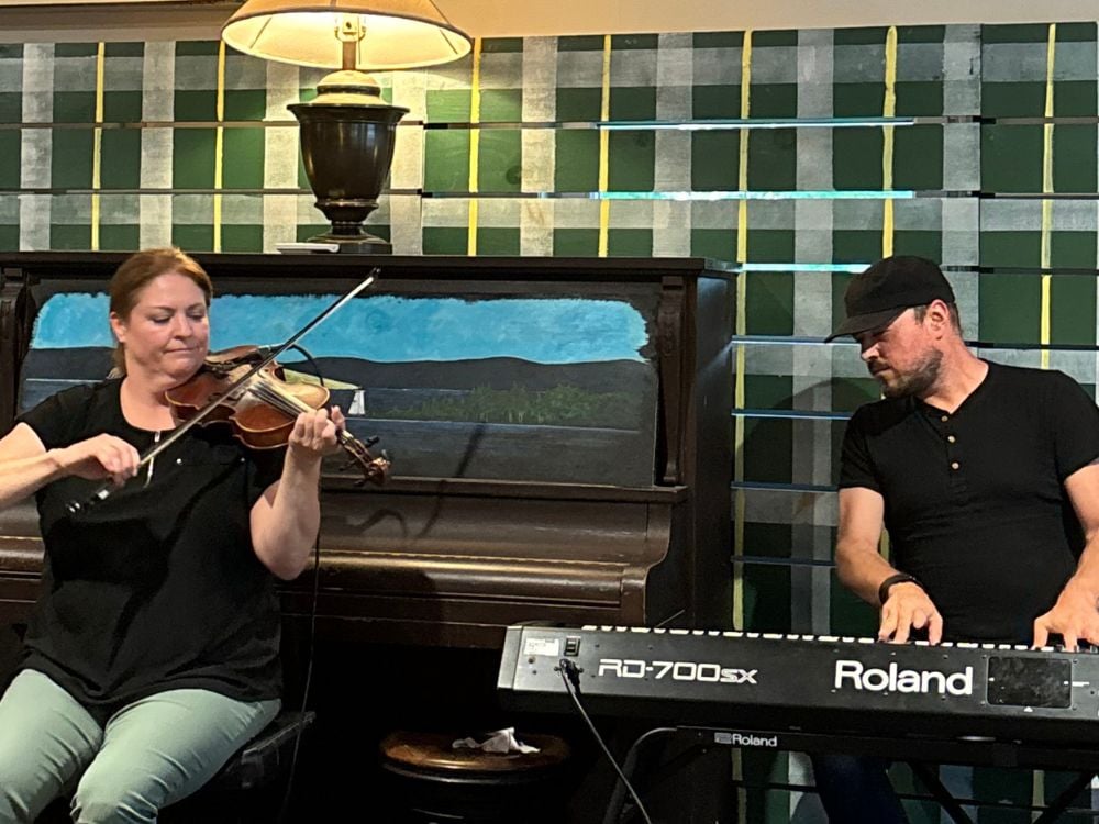 Fiddle and keyboard musicians performing at the Baddeck Gathering Ceilidh, Cape Breton
