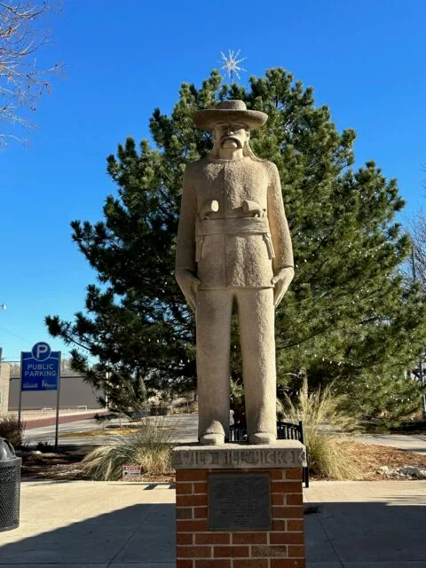 A statue of a Wild West figure in Hays, Kansas town.