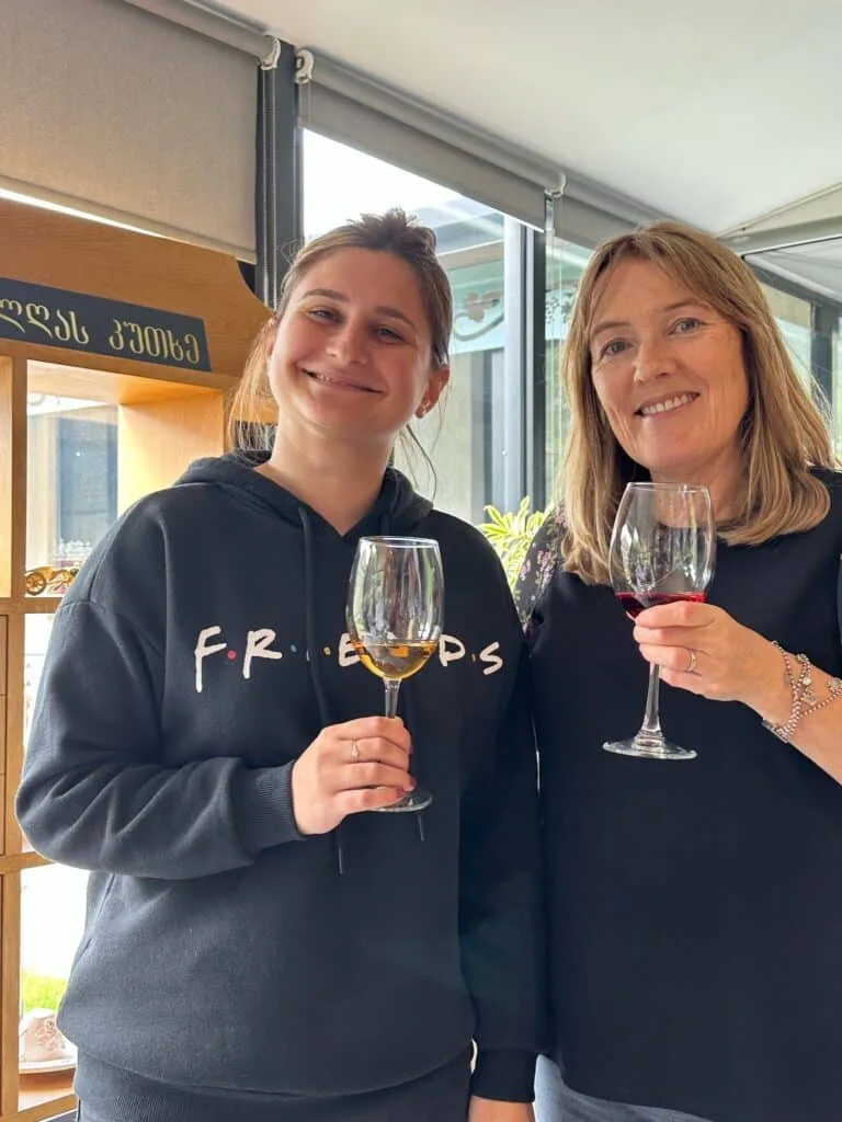 Tour guide and guest toasting with Georgian Red Wine.